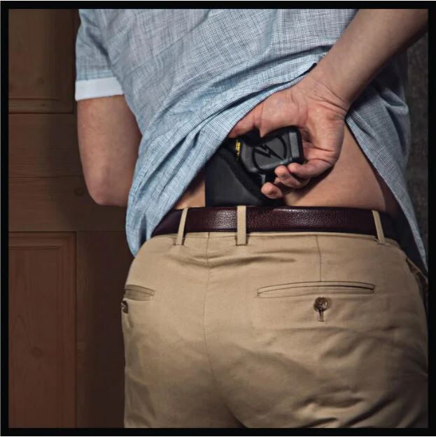 TASER Pulse sticky holster shown with TASER inserted back waistband | ThugBusters TASER Pulse sticky holster shown with TASER inserted back waistband
